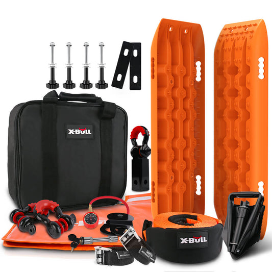 A X-BULL Winch Recovery Kit Snatch Strap Off Road 4WD Mounting Pins Recovery Tracks Boards Gen 2.0 featuring two orange recovery tracks, a black carrying bag with "X-BULL" branding, four large bolts, straps, a compact shovel, a snatch block pulley, a red recovery ring, a tire deflator, a pair of gloves, and other vital recovery accessories.