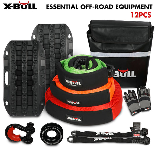 A comprehensive 4WD Recovery Kit from X-BULL, this essential off-roaders' equipment includes two traction boards, a recovery bag, three towing ropes in green, orange, and red, a pair of gloves, a shackle, a recovery ring, and two smaller straps with an included kinetic snatch strap. Labeled "X-BULL 4WD Winch Recovery Kit 12Pcs Recovery Tracks Snatch Strap Soft Shackles Recovery Ring.