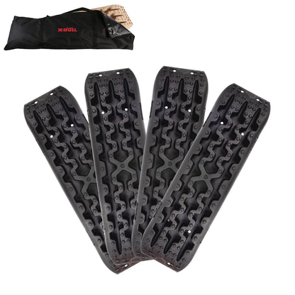 Four black X-BULL Recovery tracks / Sand tracks / Mud tracks / Off Road 4WD 4x4 Car 2 Pairs Gen 3.0 - Black, made of reinforced nylon, are arranged in a fanned-out manner on a white background. A black carrying bag with the brand "X-BULL" in red lettering is placed above the recovery tracks, hinting at their impressive load capacity and durability.