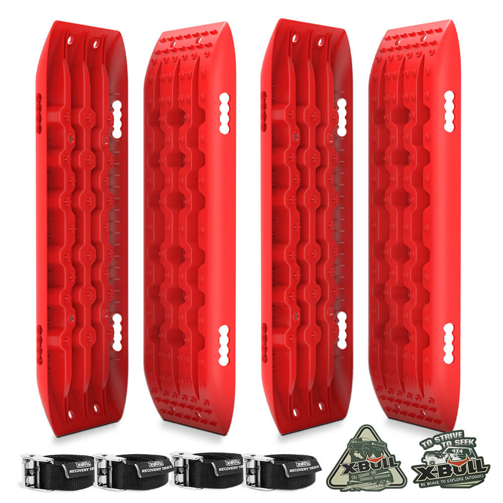 Image of four red X-BULL Recovery tracks 10T Sand Mud Snow 2 pairs Offroad 4WD 4x4 2pc 91cm Gen 2.0 - red in a staggered arrangement. Below the tracks are four black attachment straps with metal buckles and two patches with the text "XBULL" and "No Strife, No Stuck". The rugged, nylon material ensures durability, complemented by a sturdy U-shape design.