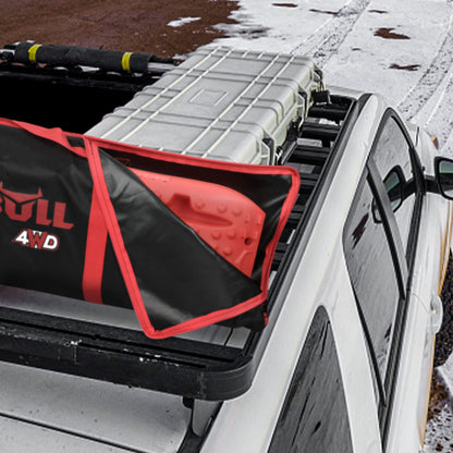 The image shows an X-BULL Recovery tracks Carry Bag 4x4 Extraction Tred Bag Black made of heavy-duty Cordura nylon, featuring red handles and accents. The "X-BULL 4WD" logo is printed on the side in red and white. The design suggests it is perfect for tracks storage and holding equipment related to off-road vehicles.