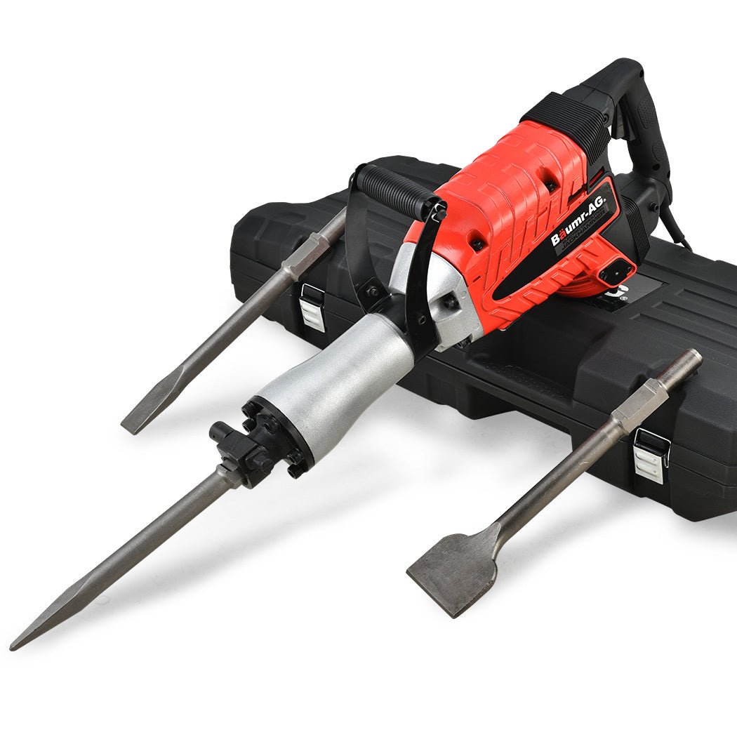 A red and black Baumr-AG 2400W Pro-Grade Electric Demolition Jackhammer, with 3 Bonus Chisels, Carry Case with a metallic chisel attachment is placed on a black carrying case. Two additional chisel attachments, one pointed and one flat, lie on either side of the Baumr-AG 2400W Pro-Grade Electric Demolition Jackhammer, with 3 Bonus Chisels, Carry Case.
