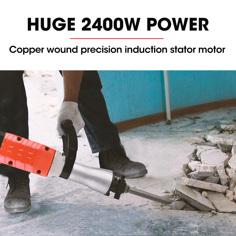 A red and black Baumr-AG 2400W Pro-Grade Electric Demolition Jackhammer, with 3 Bonus Chisels, Carry Case with a metallic chisel attachment is placed on a black carrying case. Two additional chisel attachments, one pointed and one flat, lie on either side of the Baumr-AG 2400W Pro-Grade Electric Demolition Jackhammer, with 3 Bonus Chisels, Carry Case.
