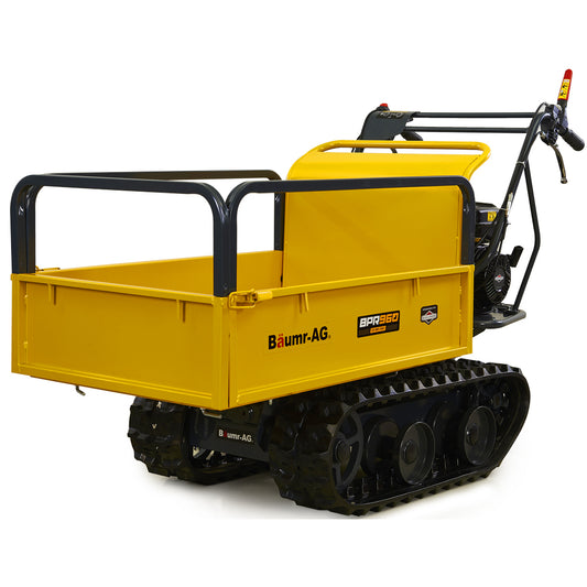 A yellow Baumr-AG Motorised Tracked Wheelbarrow Dumper, Briggs & Stratton CR950 Petrol Engine, 300kg Capacity with a black frame, rubber tracks, and an all-terrain track drive system. This motorised wheelbarrow features a large open cargo bed for transporting materials and control handles with levers for operating the machine. The logo and model name are visible on the side and back.