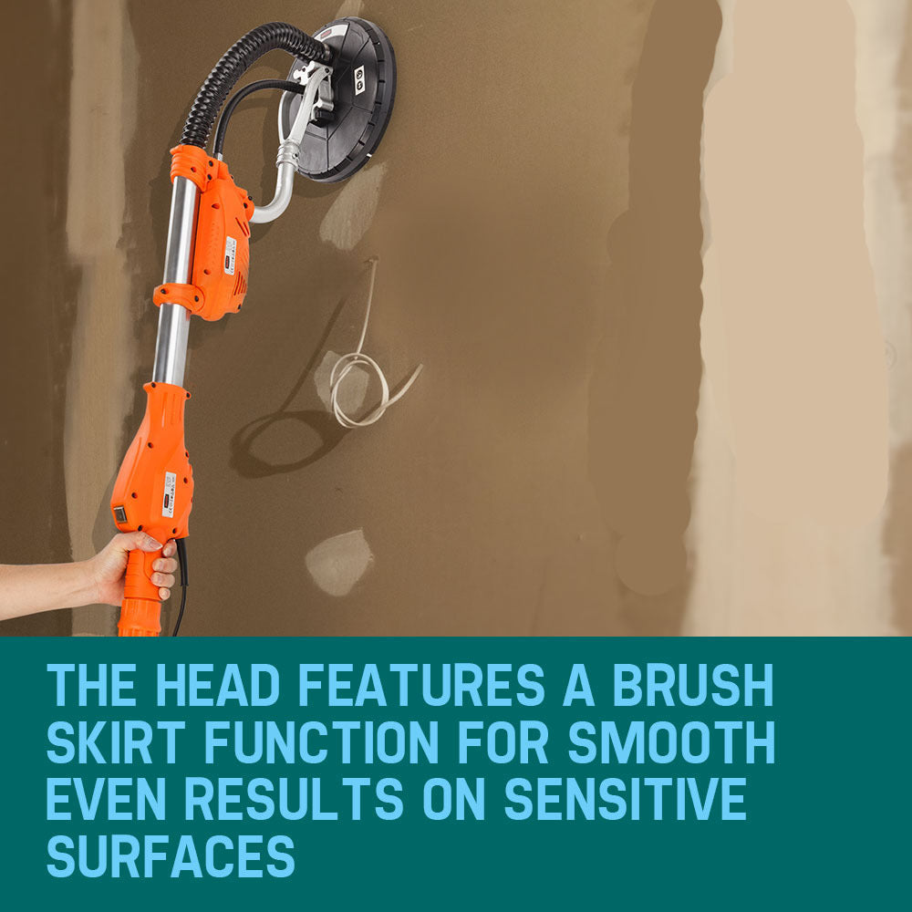 An orange and black UNIMAC Drywall Sander Plaster Wall Board Dust Free Drywall Disc Gyprock 800W with an extendable handle is shown. The kit includes a flexible hose, various attachment clips, a wrench, and a screwdriver. This commercial drywall sander features a circular sanding head with an attached power cord.