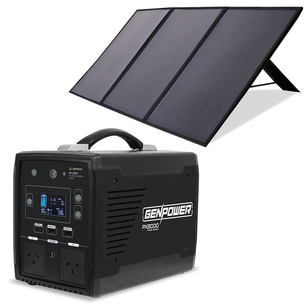 A portable power station with a handle, labeled "GENPOWER Portable Power Station Solar Generator with Folding Solar Panels 500W/1000W 515Wh Lithium," is paired with a Portable Folding Solar Panel set up at an angle. The power station has various input and output ports, a digital display, and two standard power outlets. Perfect for on-the-go energy needs.