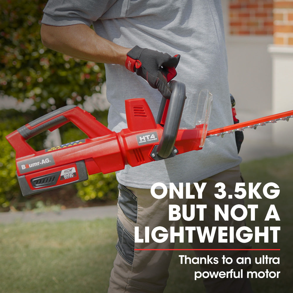 A red BAUMR-AG 40V 63cm Cordless Electric Hedge Trimmer Kit, with Battery and Fast Charger with a long, serrated blade and two black handles for an ergonomic design. Beside the trimmer is a black battery charger with an attached power cord, indicating its lithium-ion battery system. The brand label on the tool reads "LawnMaster" along with some technical specifications.