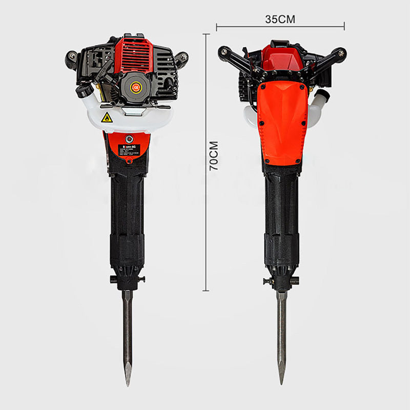 Image of a Tradie's Mate Baumr-AG JackHammer Demolition 3.5HP Petrol Jack Hammer Concrete Rock Drill with a black and red handle. The commercial-grade jackhammer features a pointed chisel head and visible engine components, including a red cooling fin, black protective cage, and yellow warning labels.