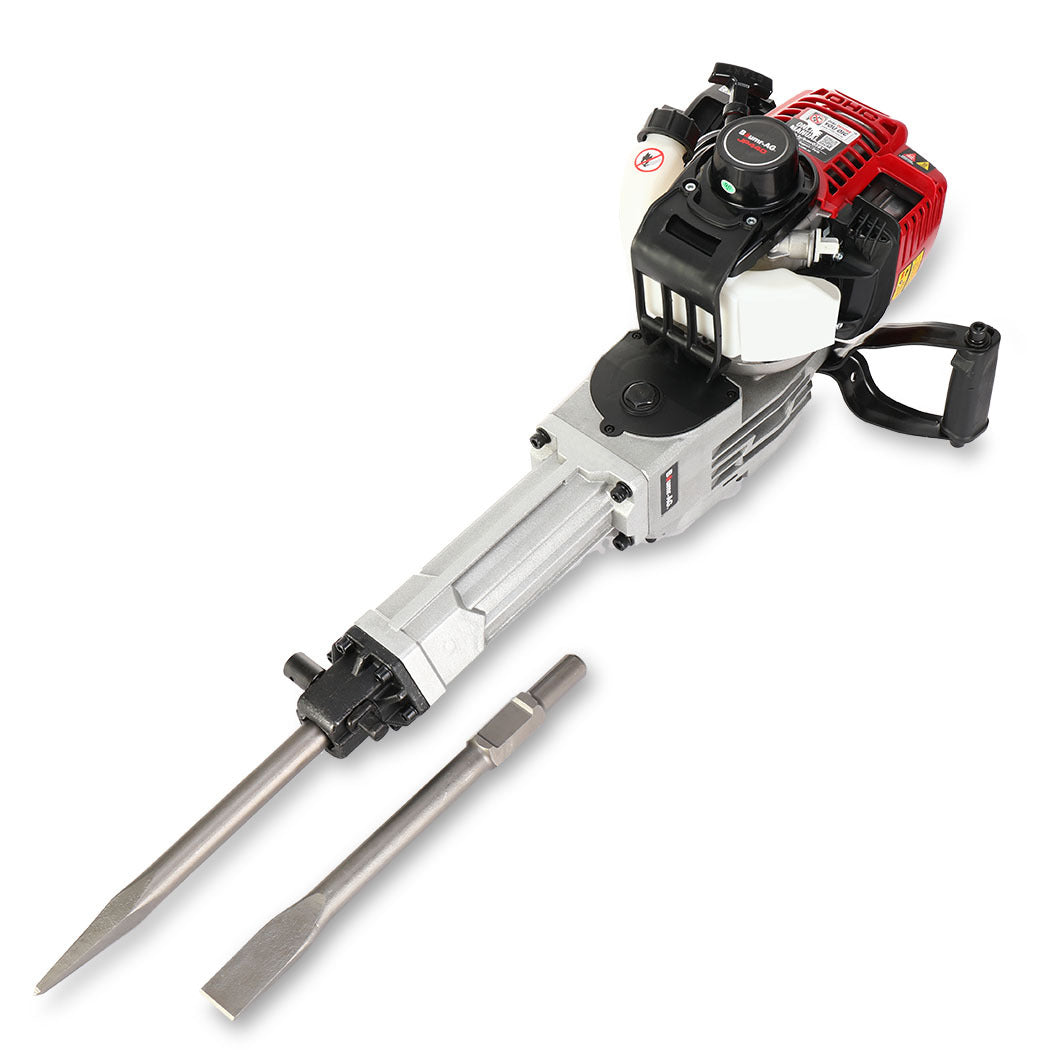 A high impact energy 4-stroke petrol jackhammer with a red and black motor sits on a plain white background. The tool, branded Baumr-AG 4 Stroke Petrol Jackhammer, with 2 Chisels, Carry Bag, has a silver body with a chisel attachment at the end. An additional chisel bit lies next to it.