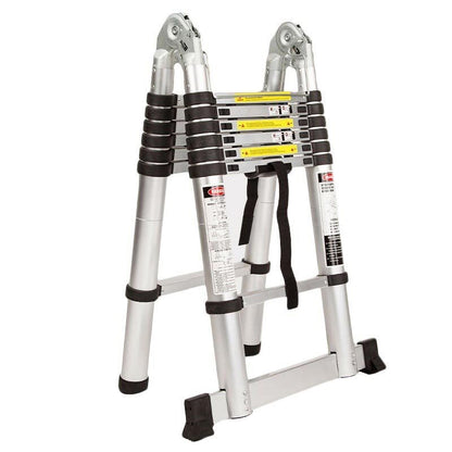 The Bullet 4.4m Multipurpose Aluminium Telescopic Folding Ladder Alloy Extension Steps with black handles and rubberized feet. Made from lightweight aluminum, the ladder has several sections that can extend or collapse, featuring multiple safety locks and labels. A black strap is attached to hold the ladder in its folded position for easy storage and transport.