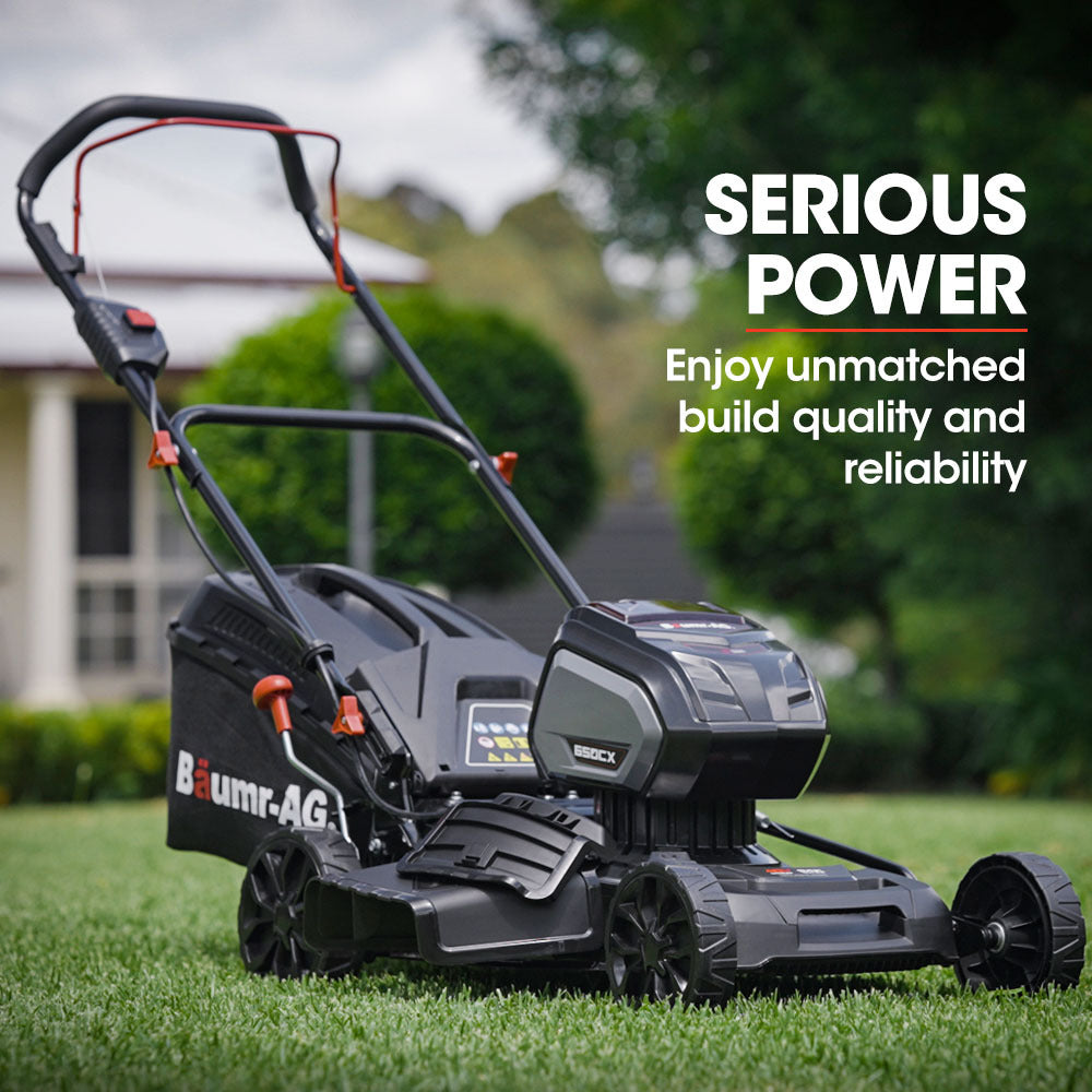 A black and red BAUMR-AG 19 Inch Lawn Mower Cordless Electric Lawnmower Kit 56V Lithium Battery Fast Charger is shown with a charging station in the foreground. The lawnmower features a sturdy design with large wheels, a grass catcher at the back, and an adjustable handle. Its brushless motor ensures efficient performance. The charging station is small and compact.