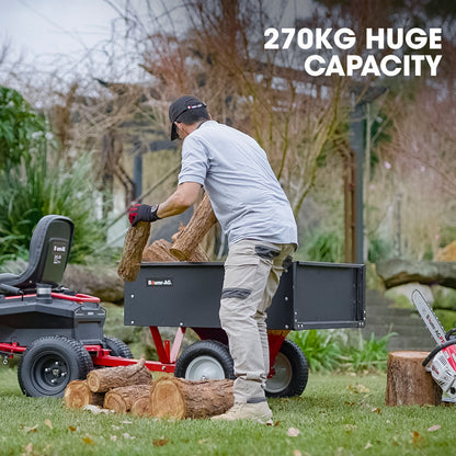 A sturdy BAUMR-AG 270kg Capacity Metal Dump Cart, for Ride on Mower with a black, rectangular open-top container on top of a red frame. It features a handle and two large wheels with white rims, offering heavy-duty gardening equipment for garden or yard work with a 270kg material capacity.