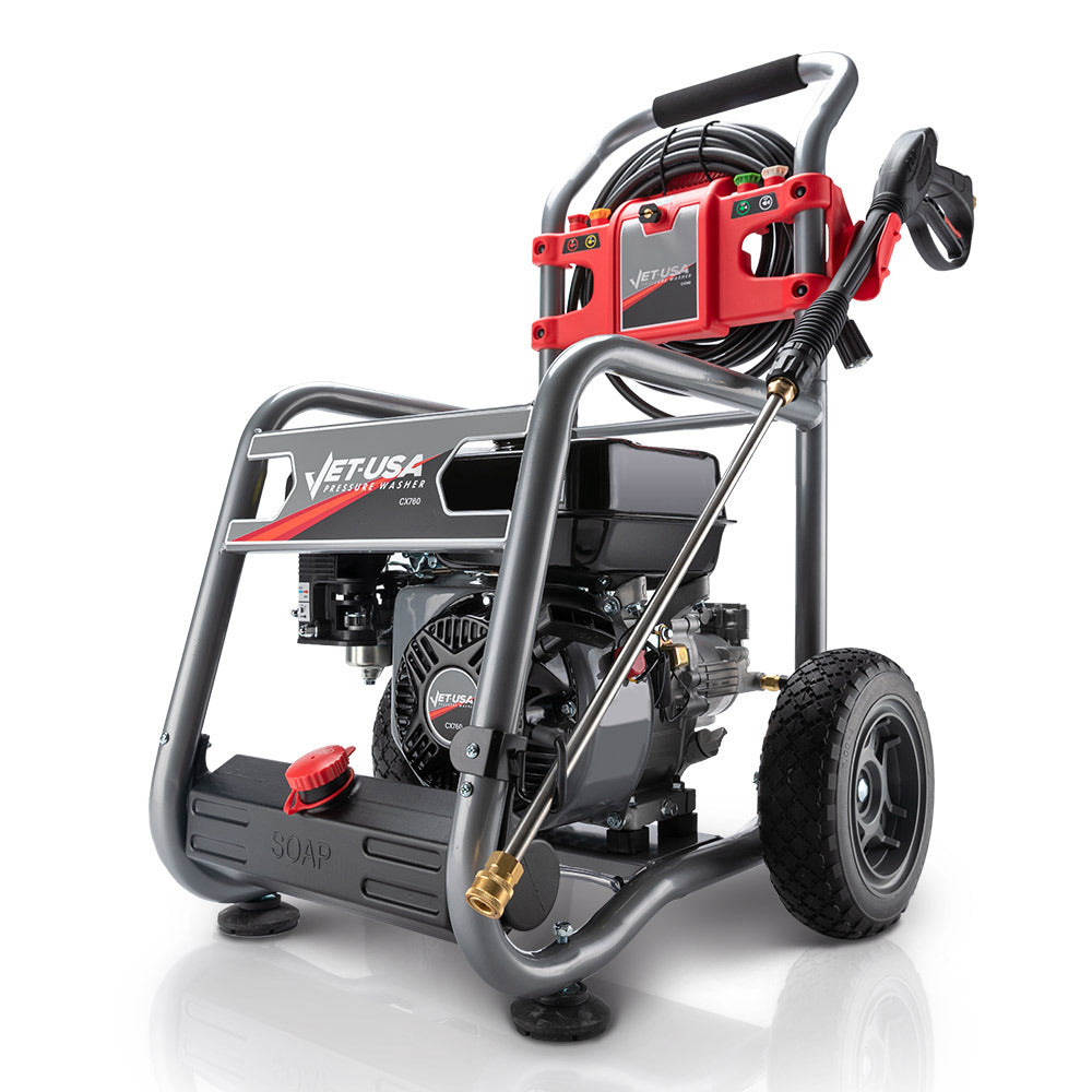 A portable pressure washer with a sturdy metal frame, large wheels, and a mounted wand. The JET-USA 4800PSI Petrol Powered High Pressure Washer, - CX760 features high-quality components, including a prominent engine, coiled hoses, and a detergent tank labeled "SOAP." It has red and black accents and a compact design.