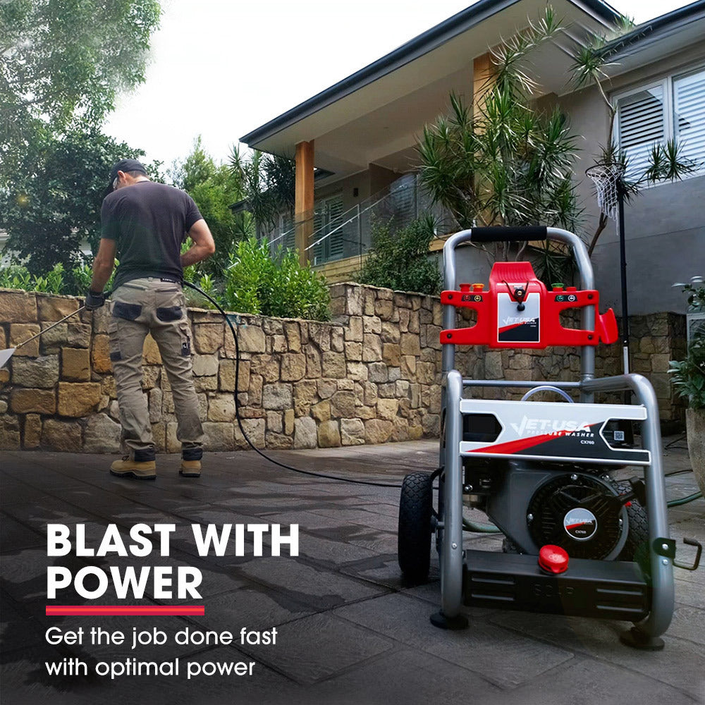 A portable pressure washer with a sturdy metal frame, large wheels, and a mounted wand. The JET-USA 4800PSI Petrol Powered High Pressure Washer, - CX760 features high-quality components, including a prominent engine, coiled hoses, and a detergent tank labeled "SOAP." It has red and black accents and a compact design.