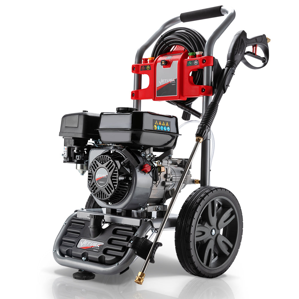 The JET-USA 4800PSI Petrol Powered High Pressure Washer, - CX630 features a black engine, large wheels, and a red control panel. Built with high-quality components, it includes various attachments and has a hose wrapped around the top. The metal frame with handlebars ensures easy maneuverability.