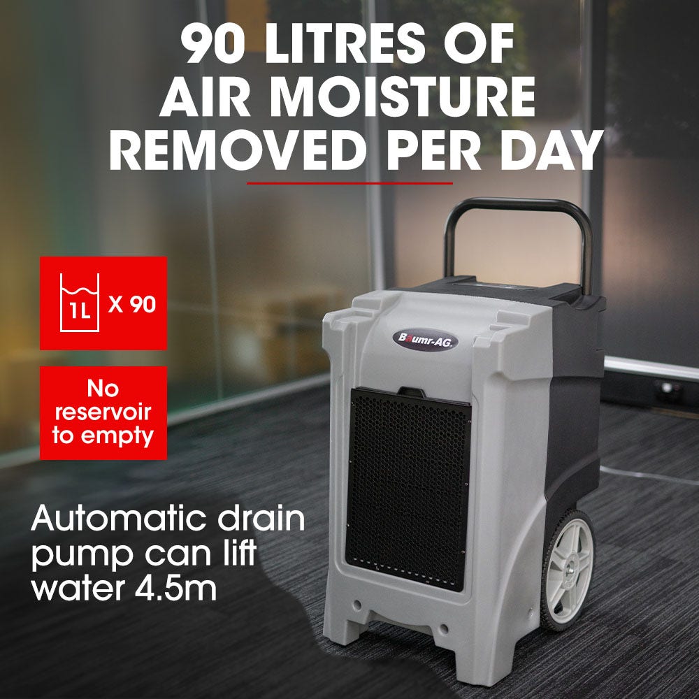 A gray and black industrial portable dehumidifier with a handle and large wheels for easy transport. The unit features a black vented front panel, the brand name "Baumr-AG 90L/day Commercial Air Dehumidifier for Mould, Portable, Stackable, LCD Display, Wheels" on the front, making it ideal for humidity control in industrial water restoration projects.