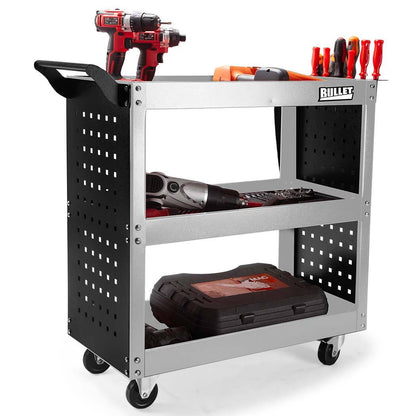 The BULLET Tool Trolley Cart Workshop Trolly Mobile Storage Steel Portable Mechanics is a must-have for any garage workshop tool storage needs. This portable tool cart on wheels features perforated side panels and offers ample space: the top shelf holds a red-and-black power drill and various hand tools, the middle shelf has a power saw and other small tools, while the bottom shelf holds a black carrying case.