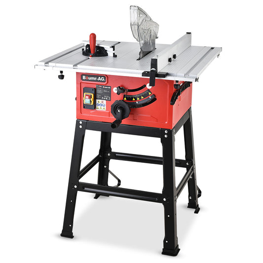 A red and black Tradie's Mate Baumr-AG 2000W 254mm Corded Table Saw with Stand, Extendable, Laser Guide with a metal tabletop, mounted on a sturdy black stand. It features a large adjustment wheel, various controls, and a blade guard on top. The brand name "Tradie's Mate" is visible on the front, alongside its 255mm steel carbide blade.