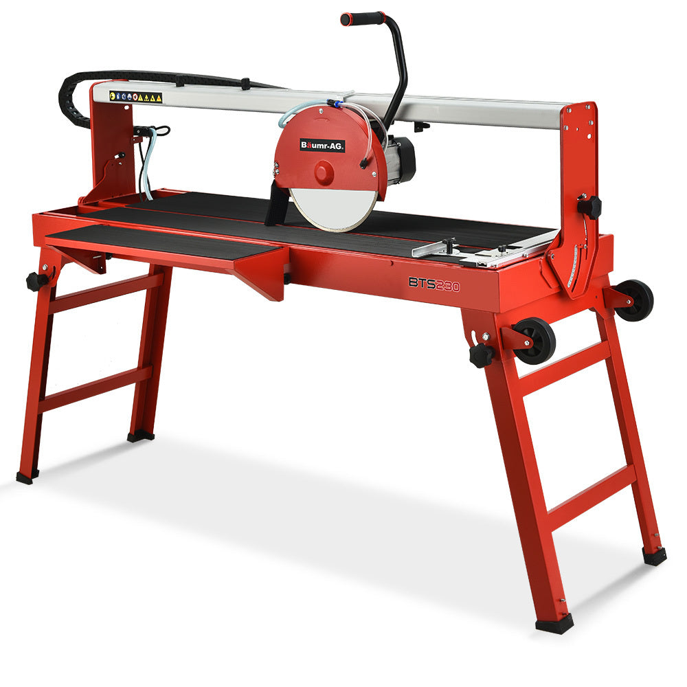 The image shows a BAUMR-AG 1500W Electric Tile Saw Cutter with a 300mm (12") Blade, 920mm Cutting Length, and Side Extension Table with a circular blade mounted on a metal stand. The stand has foldable legs and a water reservoir below the cutting surface. The saw includes a guiding rail and a handle for precision cutting, making it ideal for large format tiles.