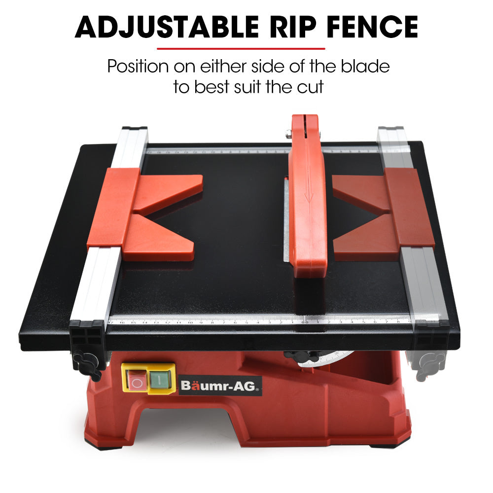 A red and black BAUMR-AG 600W Electric Tile Saw Cutter with 180mm (7") Blade features a wet-cutting system with a powerful 600W motor. The circular blade is partially covered by a protective guard, and the machine sports the "Baumr-AG" logo on the front. It also includes a measurement guide on the top surface for precise cutting.