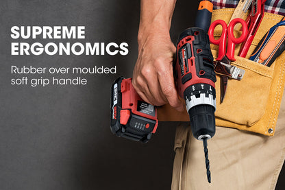 A red and black cordless drill labeled "BAUMR-AG 20V Cordless Power Drill Kit Lithium Battery Hammer Drilling with Bag" is shown from the side. The drill features TriMode technology, and an accompanying battery charger with a two-prong plug is placed beside it.