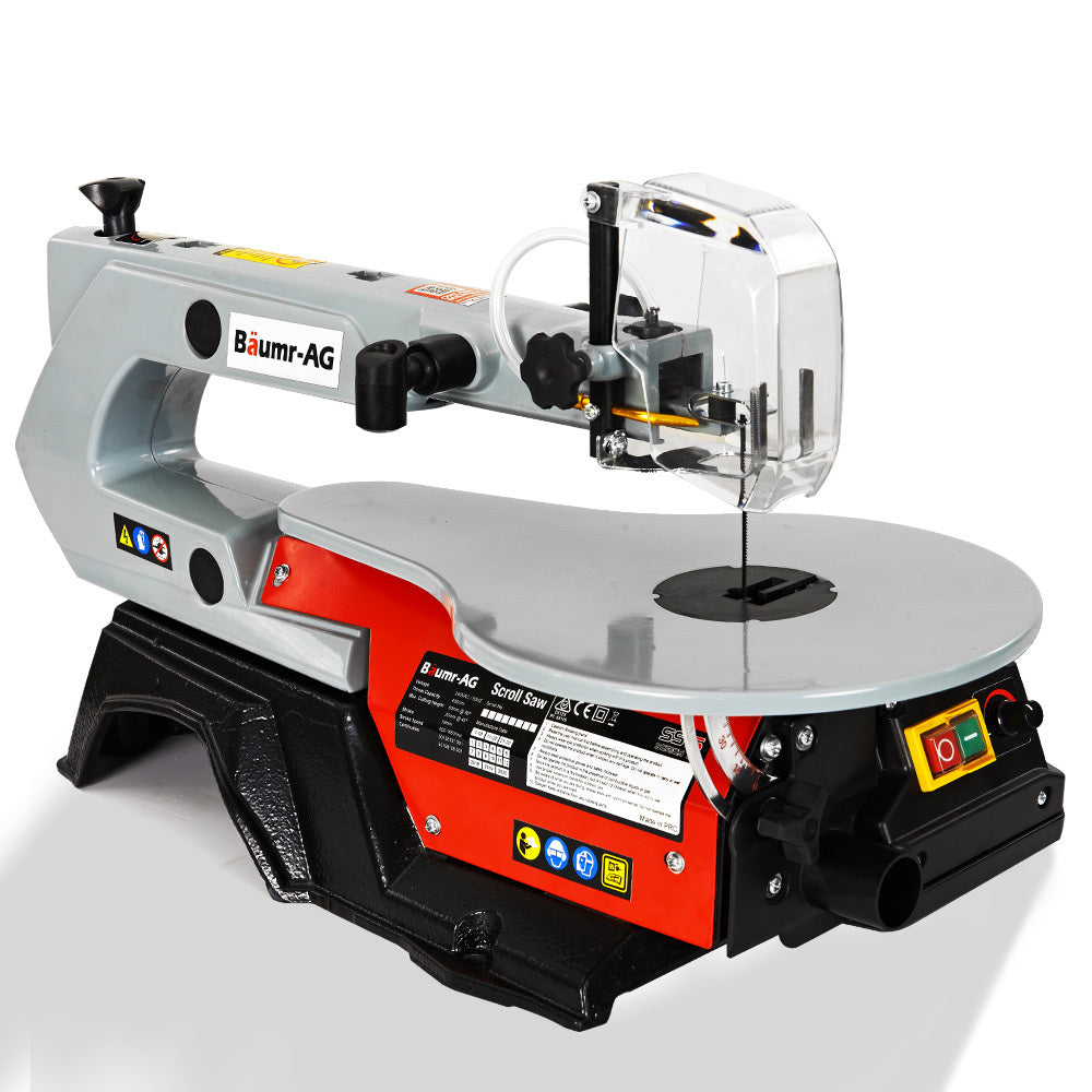 A Baumr-AG SS16 16 120W Variable Speed Scroll Saw Tool Electric Dual Lamps with a grey base and red and black accents, perfect for fine woodworking. It features an adjustable guard over the blade, a work surface, and variable speed power control buttons. Labels and indicators are visible on its base near the power switch.