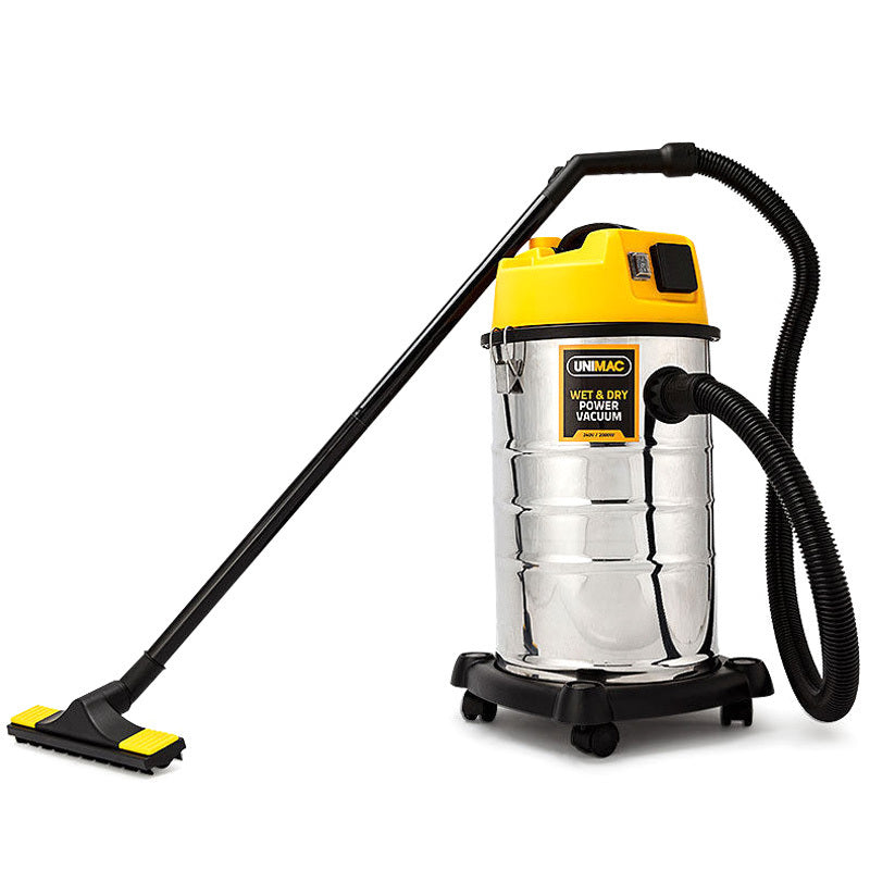 A heavy-duty 30L stainless steel vacuum cleaner with a metallic cylindrical body on wheels. It has a yellow top and a black hose extending to a floor attachment. The black handle ensures easy maneuverability, while the powerful 2000W motor delivers excellent performance. The brand name "UNIMAC 30L Wet and Dry Vacuum Cleaner Blower Bagless 2000W Drywall Vac" is visible on the front.