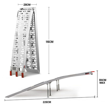 A pair of BULLET Pair of 2.3m Aluminium Loading Ramps, 1360kg capacity crafted from marine grade alloy, featuring perforated surfaces and red-tipped ends. With a 1360kg loading capacity, one ramp lies flat on the ground while the other leans against it in an open position for visibility.