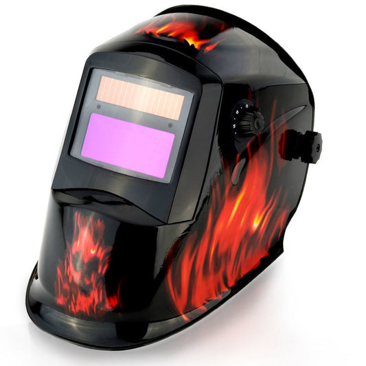 The ROSSI Solar Auto Darkening Welding Helmet Mask MIG/ARC/TIG Welder Machine showcases a striking red and orange flame design on a sleek black surface. This automatic tinting helmet features an adjustable knob on the side and a large viewing window with an auto-darkening filter, highlighted in purple.