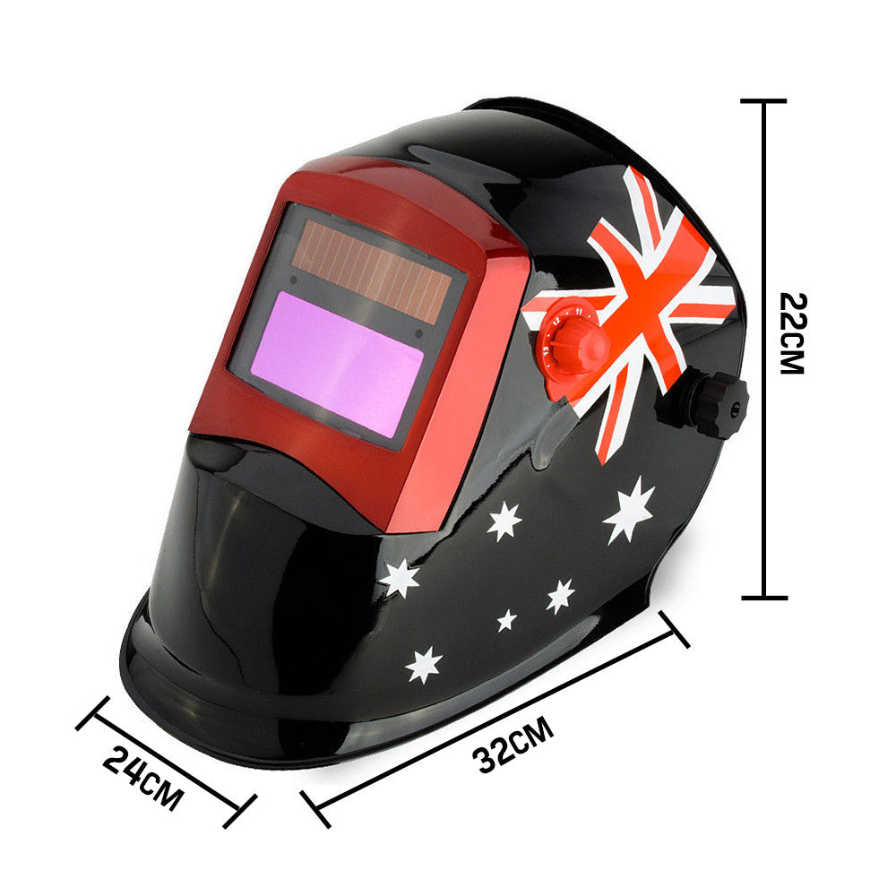 The ROSSI Solar Auto Darkening Welding Helmet MIG/ARC/TIG Welder Machine Mask, featuring a sleek black design with red trim around the viewing area, proudly displays the Australian flag with its iconic red, white, and blue design, including the Union Jack and Southern Cross stars. This helmet also boasts automatic tinting and adjustable knobs on the sides.