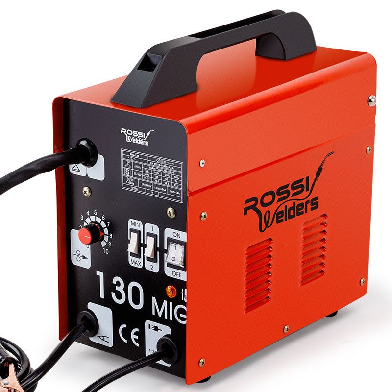 A red ROSSI 130Amp MIG Gas Gasless Welder Metal Inert Welding Machine Tool with a black handle and control panel. The control panel features a power switch, amperage dial, and indicator lights. Various cables are connected to the machine, boasting the latest in MIG technology for optimal performance at 130A current.