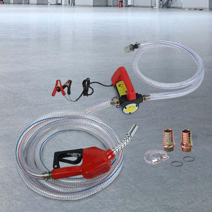 This image shows a RYNOMATE 12V Portable Electric Diesel and Kerosene Transfer Pump Extractor (45L/min) RNM-DTP-100-NMS featuring a red fuel nozzle connected to a flexible, transparent hose. The kit also includes two brass connectors, hose clamps, washers, and an ultra-fine brass filter. The coiled hose is paired with a high flow rate performance electronic pump.