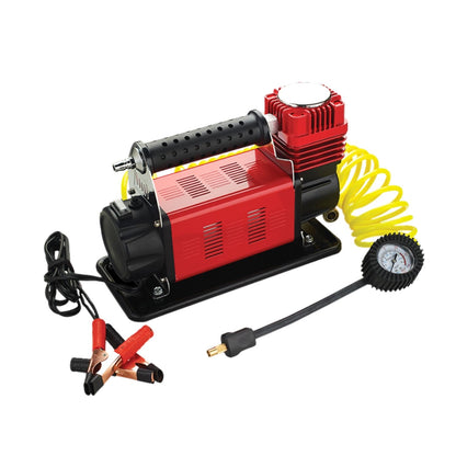 The RYNOMATE 540W Car Air Compressor for Car Tires (Red) RNM-CTAC-100-ZC featuring a red and black body with a handle, yellow coiled hose, pressure gauge for precision monitoring, and power cord with alligator clips. The device is designed for inflating tires and other inflatables with dependable performance.