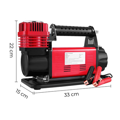 The RYNOMATE 540W Car Air Compressor for Car Tires (Red) RNM-CTAC-100-ZC featuring a red and black body with a handle, yellow coiled hose, pressure gauge for precision monitoring, and power cord with alligator clips. The device is designed for inflating tires and other inflatables with dependable performance.