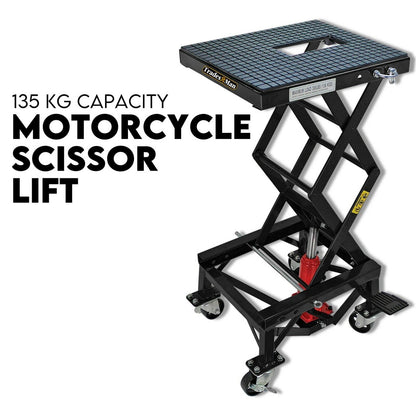 A black Motorcycle Scissor Lift Stand 135kg Hydraulic Motorbike Lifter Dirt Bike Jack is shown. It features a grid-patterned platform and caster wheels for easy mobility. The brand name "Tradesman" adorns the platform. The hydraulic motorcycle lift table is partially extended, showcasing its robust construction.