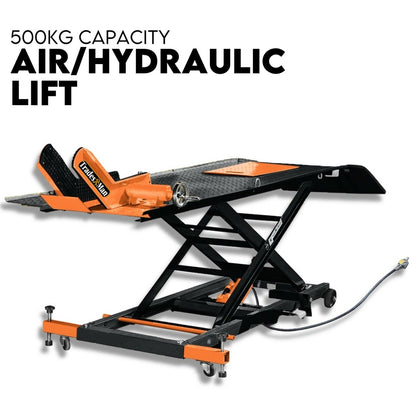 A black and orange Motorcycle Lift 500kg Table Hydraulic Air Bike Jack Mechanic Stand Hoist Lifter. The lift, crafted from heavy-duty steel construction, features a platform with a textured surface and an extendable mechanism for raising and lowering heavy objects. A hydraulic hose is attached, with "500KG CAPACITY AIR/HYDRAULIC LIFT" displayed above.