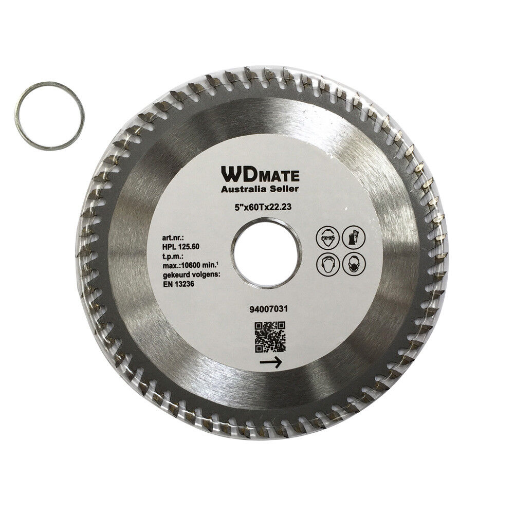 A circular saw blade labeled "125mm 60T Wood Cutting Disc 5.0" TCT Circular Saw Blade ATB 22.2/20 Timber Wheel," designed for wood cutting, with jagged teeth around the edge and a hole in the center. The tungsten carbide tipped blade is accompanied by a smaller ring with inner and outer diameters. The label includes technical details and a QR code.