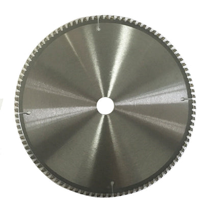 A 2x Cutting Disc 12" 300mm 100T Circular Saw Blade 30/25.4mm Aluminium Plastic with a shiny metal surface and serrated edges. The center has a white label containing text and icons, including the brand "WDMATE" and specifications such as "12’’ x 100T x 1.20." This tungsten carbide tipped blade is ideal for aluminium cutting. The background is plain white.