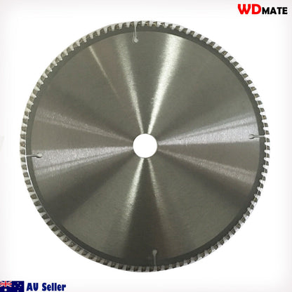 A 2x Cutting Disc 12" 300mm 100T Circular Saw Blade 30/25.4mm Aluminium Plastic with a shiny metal surface and serrated edges. The center has a white label containing text and icons, including the brand "WDMATE" and specifications such as "12’’ x 100T x 1.20." This tungsten carbide tipped blade is ideal for aluminium cutting. The background is plain white.