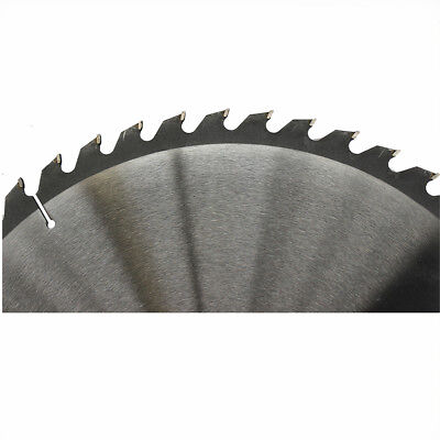 A 400mm 48T Wood Cutting Circular Saw Blade ATB 2.2*16" Cross 30/25.4mm Timber TCT with numerous sharp teeth around its edge is shown. The blade, ideal for cross-cutting tasks, has a label at its center with text including "WD Mate" and technical specifications. Beside the tungsten carbide tipped saw blade on the left side lies a small circular ring.