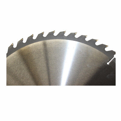 A 400mm 48T Wood Cutting Circular Saw Blade ATB 2.2*16" Cross 30/25.4mm Timber TCT with numerous sharp teeth around its edge is shown. The blade, ideal for cross-cutting tasks, has a label at its center with text including "WD Mate" and technical specifications. Beside the tungsten carbide tipped saw blade on the left side lies a small circular ring.