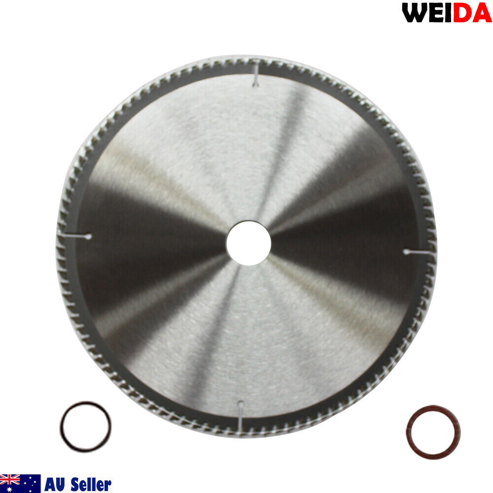 Circular saw blade branded "WEIDA" features a 254mm Wood Circular Saw Blade Cutting Disc 10" 100T Bore 30/25.4 mm K 2.8mm, with text indicating it is a 10"x100Tx30 model. Specifications include "art.nr: MTS 254.100," "t.p.m. max. 6000 min-1," and compliance with "EN 13236." Two small red rubber rings are included at