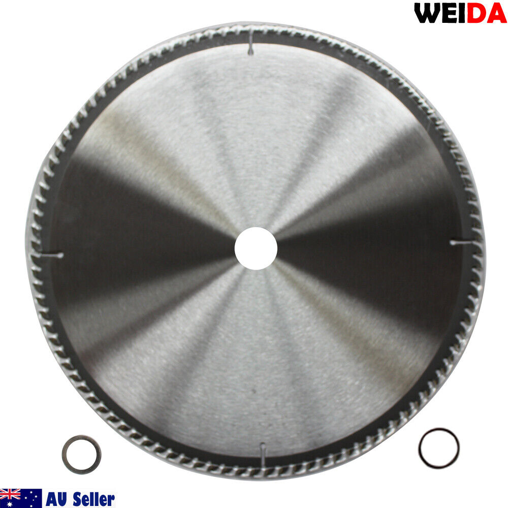 A 350mm 100T Wood Circular Saw Blade Cutting Disc 14" Bore 30/25.4mm K3.5mm Timber, ideal for wood cutting, features a silver, wavy-tooth edge with tungsten carbide-tipped teeth. The packaging details maximum speed, certifications, and includes a QR code. Two rings are shown beside the cutting disc.