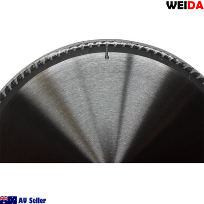 A close-up image of a 2x 350mm 100T Wood Circular Saw Blade Cutting Disc Cut 14" Bore 30/25.4mm K3.5mm, specifically a tungsten carbide tipped blade with 100 teeth and a 30 mm bore. Labeled for an Australian seller, it features product details and a QR code in the center. Two small washers are placed beside it, ideal for wood cutting.