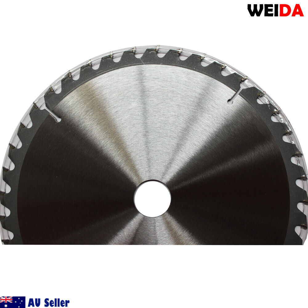 A circular saw blade labeled "3x 254mm Wood Circular Saw Blade Cutting 10’’40T Bore 30/25.4/22.23mm K 2.8mm." This tungsten carbide tipped cutting disc is 10 inches in diameter with 40 teeth. Other specifications include a 30mm arbor. Various certification icons and a QR code are visible on the blade. The image includes two washers placed beside the blade.