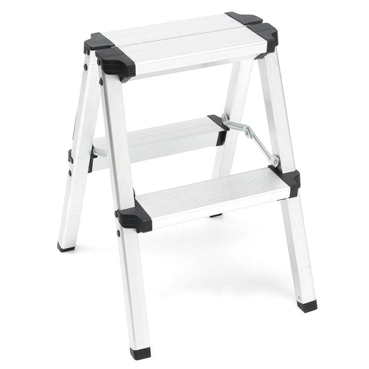 A small, silver, lightweight aluminum frame ladder with black plastic hinges and feet. This 2-Step Portable Folding Ladder, Aluminum Frame Lightweight Home Ladder with Anti Slip Design, 150KG Capacity is designed for indoor use, featuring an anti-slip surface. It is compact and ideal for reaching items on high shelves or completing light tasks around the house.