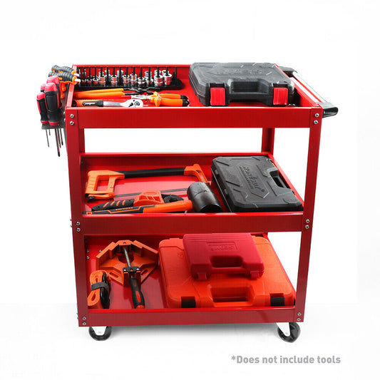 A heavy-duty, red, three-tiered Tool Trolley 3-Tier Workshop Cart Rolling Steel Parts Storage Handyman 150KG Red features several compartments and holders, containing an assortment of tools such as screwdrivers, clamps, and cases. The cart has a handle and is on wheels for mobility. Note at the bottom reads, "Does not include tools.