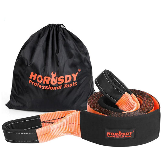 A Heavy Duty Recovery Tow Strap Kit 4" x 20Ft Snatch Straps - 18T/40,000LB Break Strength for Off-Roading Recovery and Hauling, labeled "HORUSDY Professional Tools," is neatly coiled next to a black storage bag with the same branding. The strap is orange with black reinforcements on the loops for added durability, making it perfect for off-road recovery.