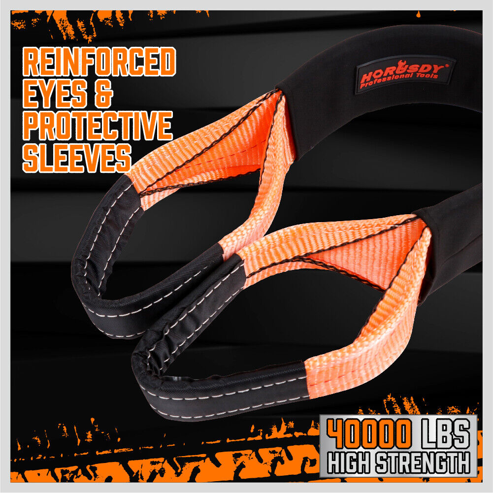 A Heavy Duty Recovery Tow Strap Kit 4" x 20Ft Snatch Straps - 18T/40,000LB Break Strength for Off-Roading Recovery and Hauling, labeled "HORUSDY Professional Tools," is neatly coiled next to a black storage bag with the same branding. The strap is orange with black reinforcements on the loops for added durability, making it perfect for off-road recovery.