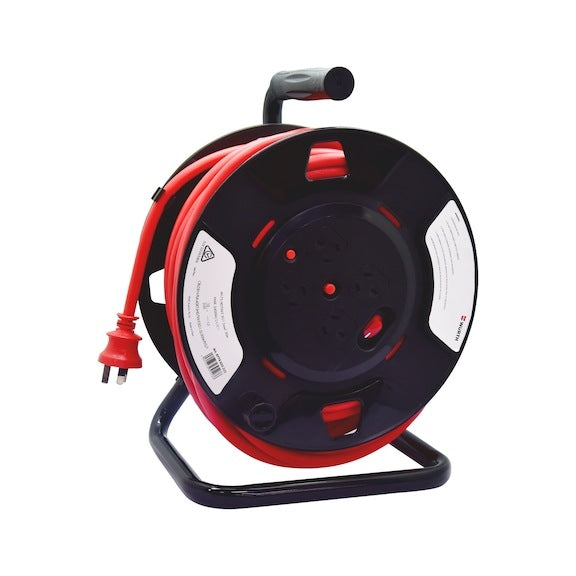 A Wurth 4 Socket Power Extension Cord 30m Heavy Duty Cable Reel 10A Lead Electric with a handle on top and a stand at the bottom. The shatterproof plastic cable drum holds a long red power cord with an AU/NZ plug and socket, visible in the front. The reel features white labels with text and symbols on both sides.